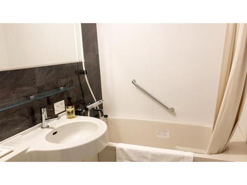 a bathroom with a sink and a toilet and a tub at Hotel Sunrise Choshi - Vacation STAY 73479v in Choshi