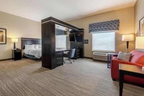 a hotel room with a bed and a desk at Hampton Inn Alamosa in Alamosa