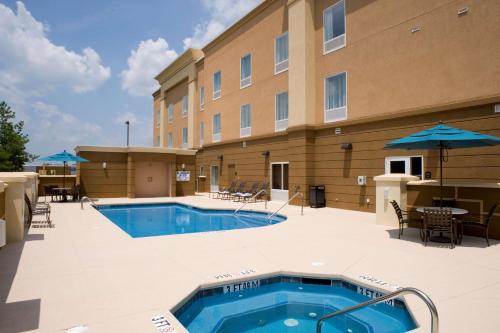 a swimming pool in front of a hotel at Hampton Inn Anderson/Alliance Business Park in Anderson