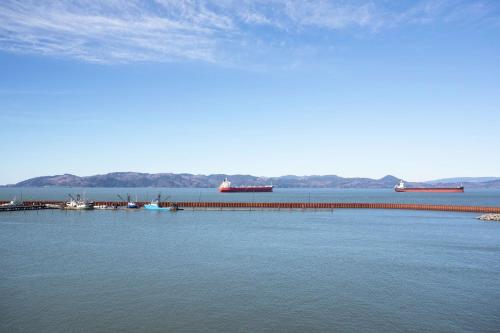 a large body of water with boats and a dock at Hampton Inn & Suites Astoria in Astoria, Oregon