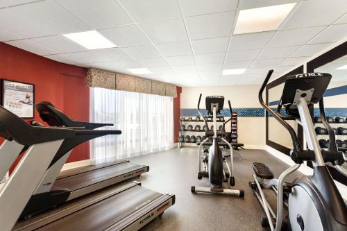 a gym with two treadmills and cardio machines at Hampton Inn Watertown in Watertown