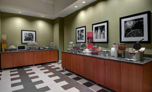 a lobby with a cash counter in a hotel at Hampton Inn & Suites Astoria in Astoria, Oregon