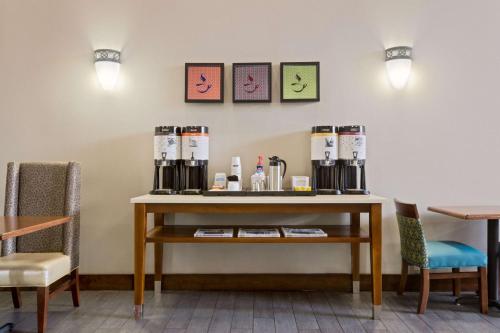 a table with a coffee maker on top of it at Hampton Inn & Suites Atlanta/Duluth/Gwinnett in Duluth