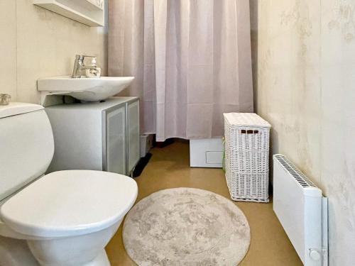 a bathroom with a white toilet and a sink at 7 person holiday home in KöPINGSVIK-By Traum in Köpingsvik
