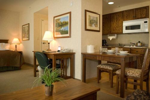 a room with a kitchen and a living room at Homewood Suites Bakersfield in Bakersfield