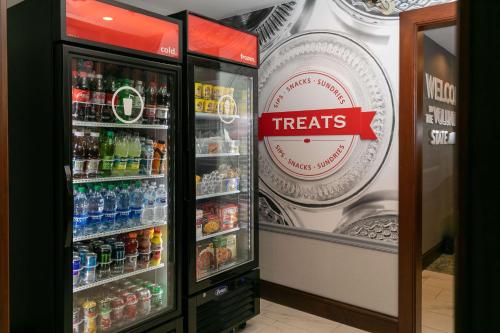 a refrigerator filled with lots of bottles of soda at Hampton Inn & Suites Nashville-Green Hills in Nashville