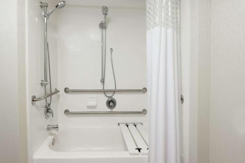 a bathroom with a white shower curtain and a sink at Hampton Inn Boston / Marlborough in Marlborough