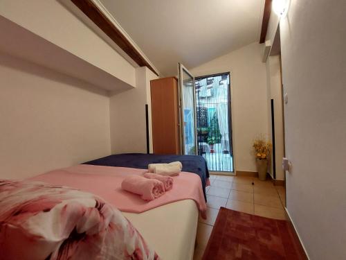 a bedroom with a bed with two towels on it at Leona in Novigrad Istria