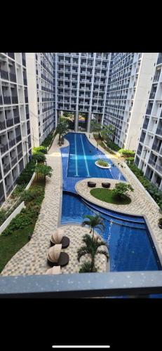 an overhead view of a swimming pool in a building at Overnight @ Shakhbot's in Manila