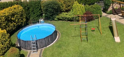 an overhead view of a backyard with a swimming pool at Villa Aida in Mielno