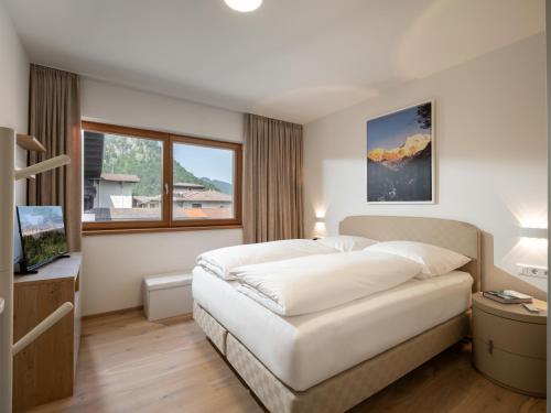Postel nebo postele na pokoji v ubytování Herzi Chalet - top ausgestattet, neu, chic und sehr gemütlich