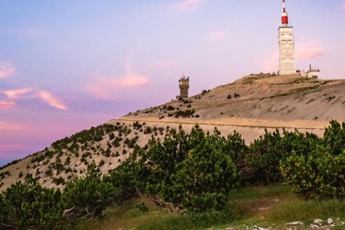two white lighthouses sitting on top of a hill at Location appartement 1 chambre et dépendance en supplément voir infos importantes dans un mas provençal au coeur du luberon in Cavaillon