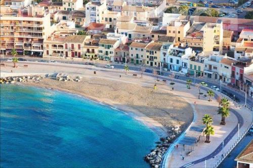 an aerial view of a beach with buildings at Experience beautiful duplex penthouse with terrace in Palma in Palma de Mallorca