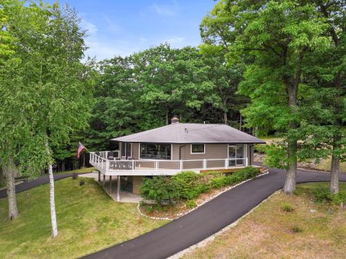 an aerial view of a house with a driveway at Glen Lake Ridge in Empire