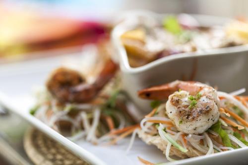 a plate of food with shrimp and other foods at Galle Fort Hotel in Galle