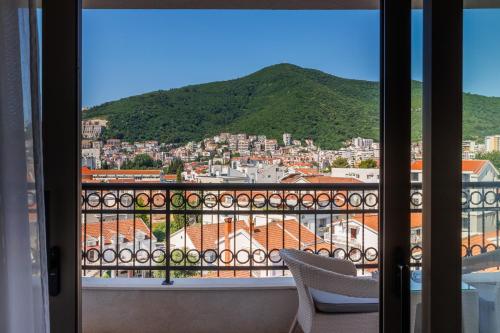 a view of a city from a balcony at Hotel Kadmo by Aycon in Budva