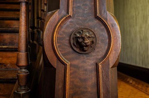 a wooden door with a lion head on it at The Waldoboro Inn in Waldoboro