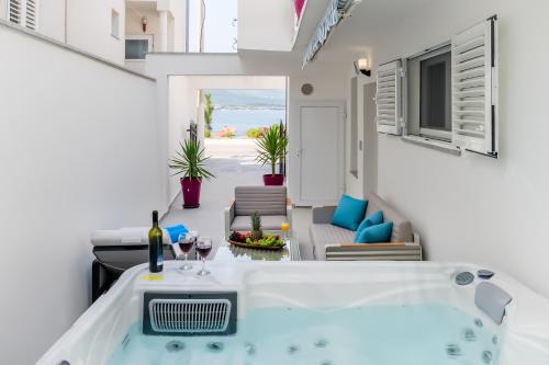 a room with a view of the ocean in a house at Luxury apartment on the beach in Trogir