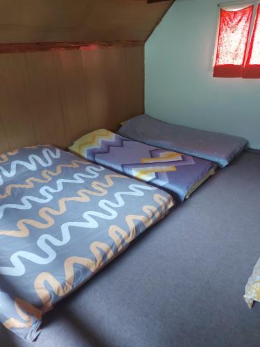 Krevet ili kreveti u jedinici u okviru objekta Vikendica Žute dunje Jajce