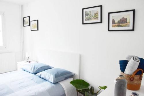Łóżko lub łóżka w pokoju w obiekcie Appartement 4 Chambres