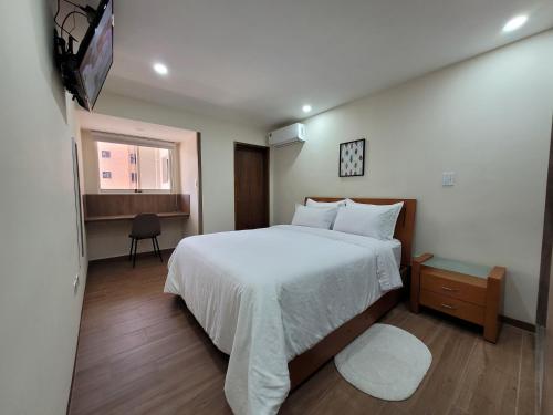 Tempat tidur dalam kamar di Apartamento Base Aragua con planta eléctrica