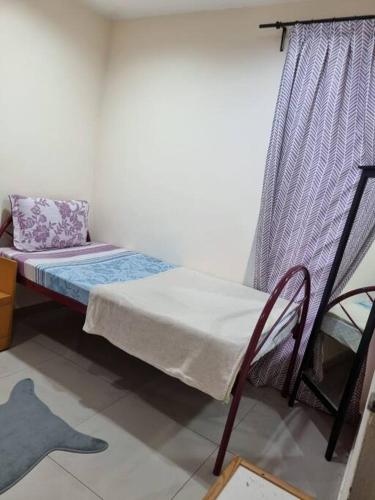 Ένα ή περισσότερα κρεβάτια σε δωμάτιο στο Landed Corner-Lot Townhouse Homestay GG Greenwood Gombak