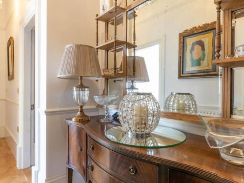 a table with two lamps on top of it at Walpole View - Balcony Apartment - Stunning Seafront Views -TV over bath -2mins beach in Kent