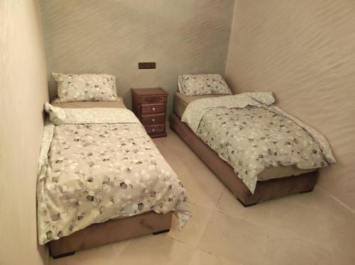 Katil atau katil-katil dalam bilik di Appartements et chambres meublés