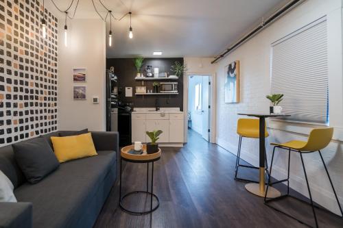 a living room with a couch and a kitchen at The 505 Eugene in Eugene