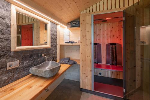 a bathroom with a sink and a mirror at Mesnerhof my Paradise in Fiè