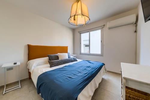 Кровать или кровати в номере Viaggiato Salguero