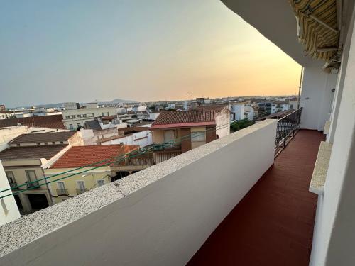 a view of a city from a balcony at Imperium Apartamentos Centro Parking Gratis in Mérida