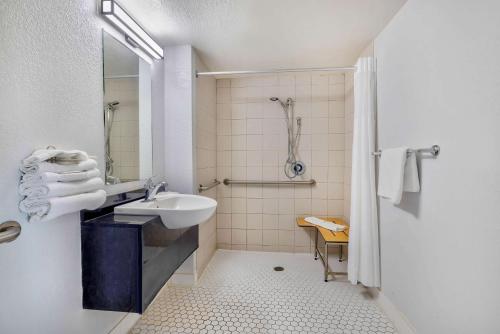 a white bathroom with a sink and a shower at Motel 6-Hammond, IN - Chicago Area in Hammond