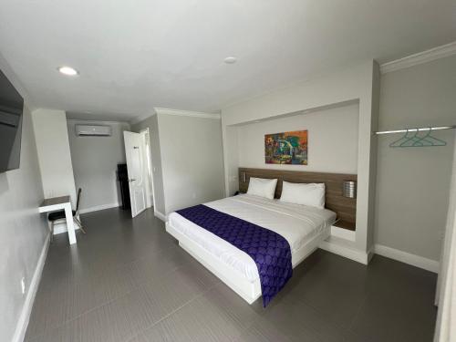 a bedroom with a large bed in a room at The Biscayne Hotel in Miami