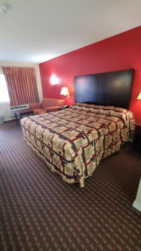 Ένα ή περισσότερα κρεβάτια σε δωμάτιο στο Western Motel