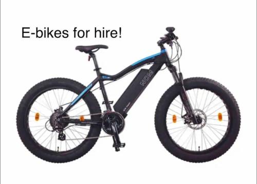 a bike is shown with the words e bikes for hire at Magical Loft - Homewood Forest Retreat in Alexandra