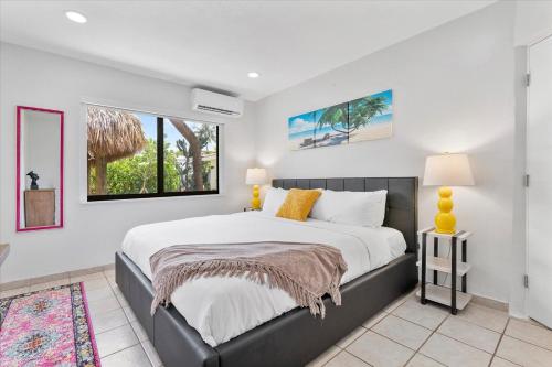 a bedroom with a large bed and a window at Walnut By The Sea in Hollywood