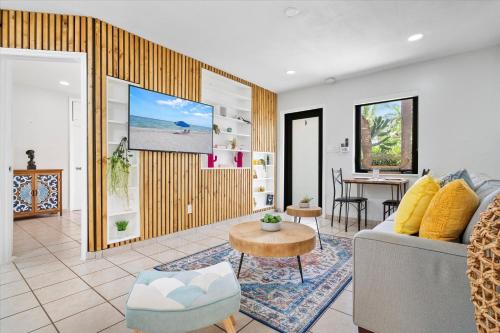 a living room with a couch and a table at Walnut By The Sea in Hollywood