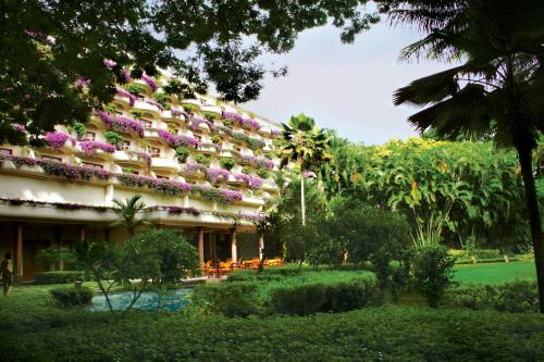 a hotel with flowers on the side of it at The Oberoi Bengaluru in Bangalore