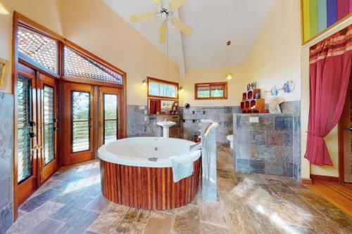 a large bathroom with a large tub in the middle at Divina @ Framadani Estate in San Ignacio