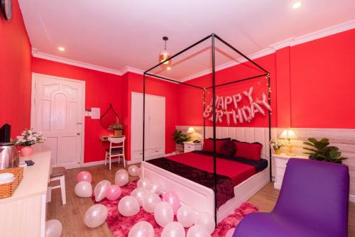 a bedroom with a bed with a happy birthday sign at Ben Thanh Station Hotel in Ho Chi Minh City