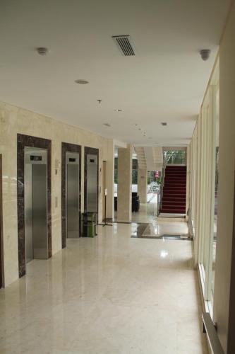 an empty hallway with elevators in a building at Laras Asri Resort & Spa in Salatiga