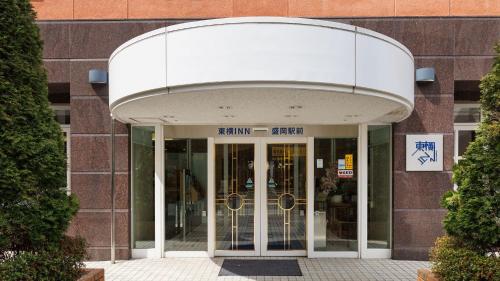an entrance to a building with glass doors at Toyoko Inn Morioka Ekimae in Morioka