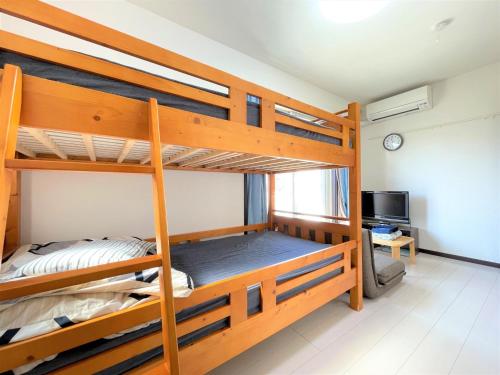 מיטה או מיטות קומותיים בחדר ב-Credo Maison Kamakura - Vacation STAY 10394