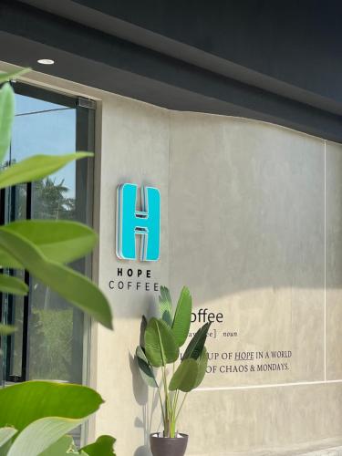 a sign on the side of a building at Vvip Hotel in Hutan Melintang