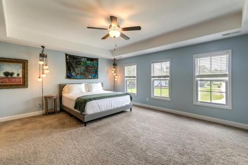a bedroom with a bed and a ceiling fan at Holly Ridge Vacation Rental about 5 Mi to Beach in Holly Ridge