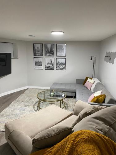 a living room with a couch and a table at Stylish Urban Retreat 3 Bedroom Newly Remodeled in Chicago