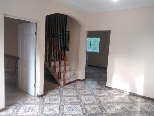 a hallway with a staircase in a house at Casa Gonzalez 