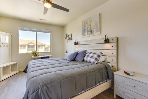 a bedroom with a bed and a window at Mesquite Vacation Rental Condo with Resort Amenities in Mesquite
