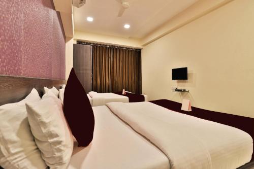 Ein Bett oder Betten in einem Zimmer der Unterkunft Hotel Royal Rituals